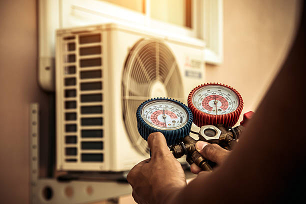 Professional Air Conditioning Service technician working in Bridgeport, AL